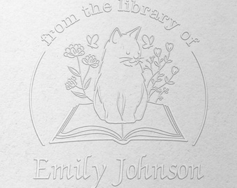 May include: A black and white illustration of a cat sitting on a book with flowers and butterflies around it. The text "from the library of Emily Johnson" is below the image.