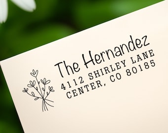 May include: A return address label with a simple floral design and the text "The Hernandez, 4112 Shirley Lane, Center, CO 80185".