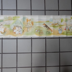 May include: A vintage illustrated story panel featuring anthropomorphic animals in a pastoral setting. The artwork depicts scenes with a cat, fox, squirrels, and other characters. The color palette includes soft greens, yellows, and browns.