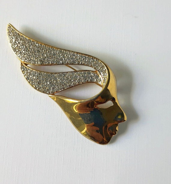 Eighties modernist mask brooch with rhinestone hai