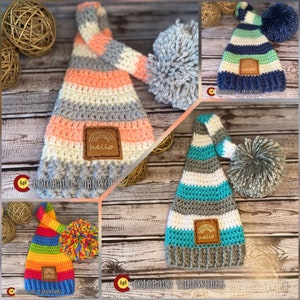 May include: Four crocheted hats with pom-poms and a "hello" patch. The hats are in different color combinations: pink and gray, blue and green, teal and gray, and rainbow.