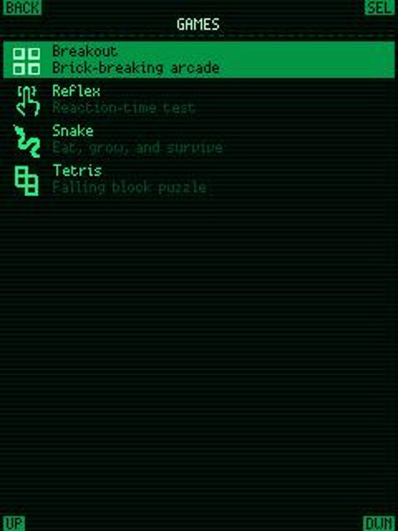 May include: A digital screen interface displaying a list of games in bright green text on a dark background. The menu includes Breakout, Reflex, Snake, and Tetris, each with a corresponding icon and a short descriptive subtitle for each game title.