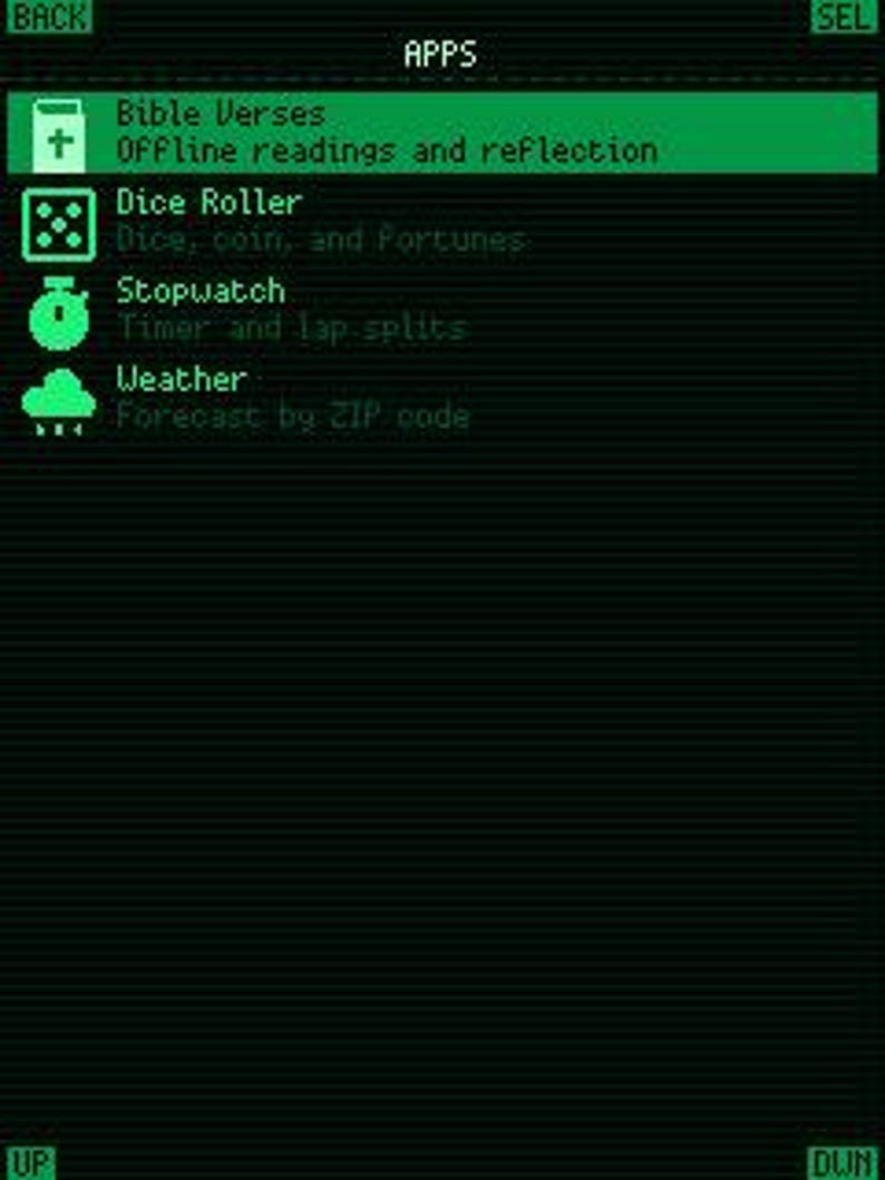 May include: A digital interface screen with a dark background and bright green text. The menu displays APPS with options for Bible Verses, Dice Roller, Stopwatch, and Weather, each accompanied by a small icon. Navigation buttons labeled BACK, SEL, UP, and DWN are visible.