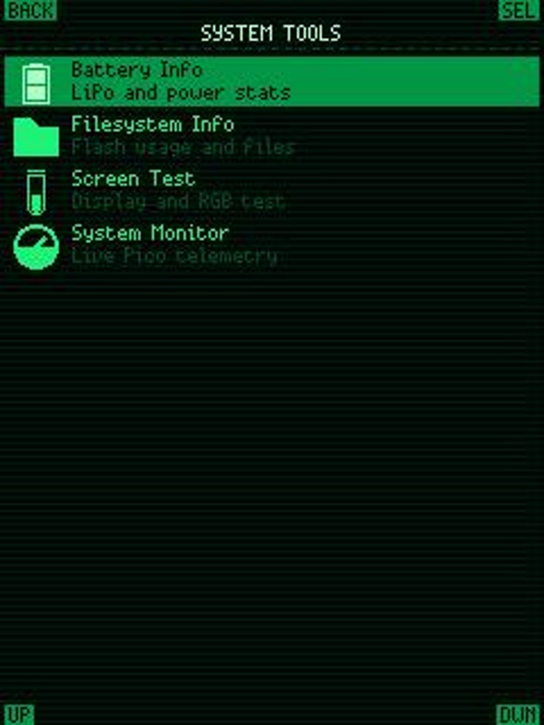 May include: A digital screen interface titled SYSTEM TOOLS in bright green text on a dark background. The menu lists Battery Info, Filesystem Info, Screen Test, and System Monitor with corresponding icons. Navigation buttons labeled BACK, SEL, UP, and DWN are visible.
