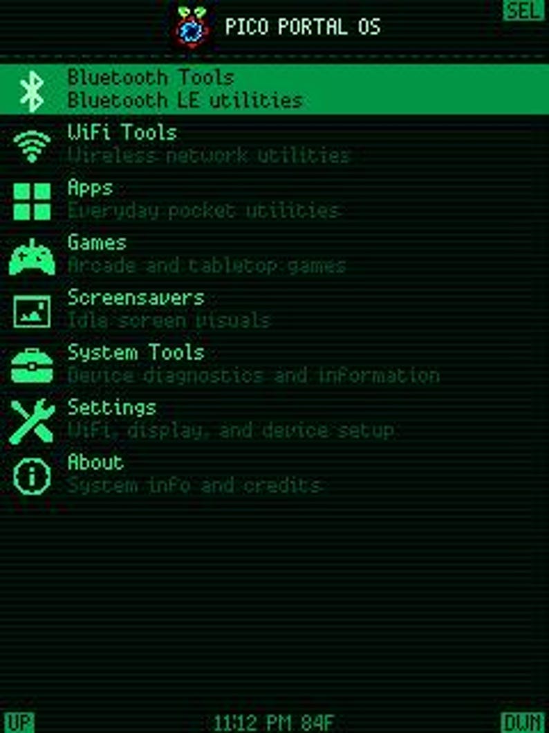May include: A digital screen display for Pico Portal OS featuring a green text menu on a black background. The interface lists categories including Bluetooth Tools, WiFi Tools, Apps, Games, Screensavers, System Tools, Settings, and About.