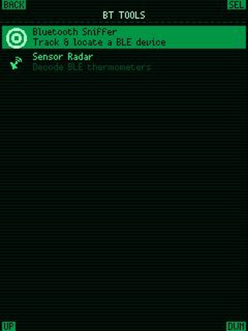 May include: A digital screen interface titled BT TOOLS with a green and black color scheme. The menu displays options for Bluetooth Sniffer to track and locate a BLE device, and Sensor Radar to decode BLE thermometers, with navigation buttons.