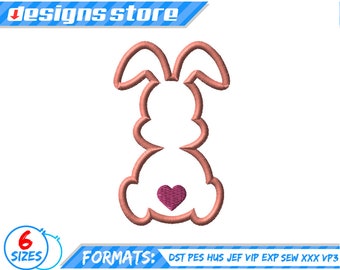 May include: A pink bunny rabbit embroidery design with a pink heart on its belly. The design is available in six sizes and multiple formats, including DST, PES, HUS, JEF, VIP, EXP, SEW, XXX, and VP3.