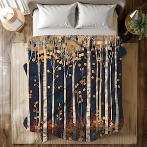 May include: A navy blue blanket with a birch tree design. The trees have white trunks and orange and yellow leaves. The blanket is on a bed with white pillows and a wooden nightstand.
