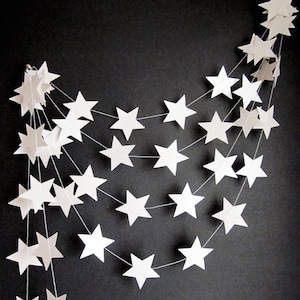 A stitched white star garland with hanging loops stitched at either end.  Offered in other colours.