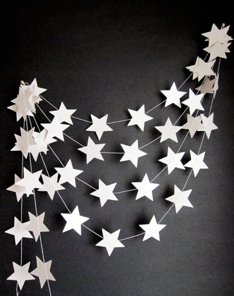 A stitched white star garland with hanging loops stitched at either end.  Offered in other colours.