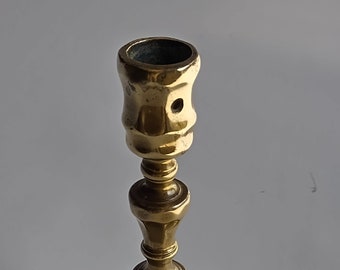 Bronze faceted candlestick with octagonal base, elaborate baluster stem and faceted socket, ca. 1690 - 1720, rare