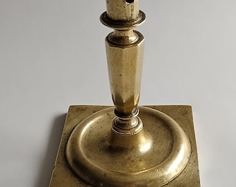 A beautiful late 17th century Spanish brass candlestick, circa 1690/1700