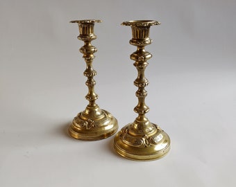 A remarkable and rare set of French 18th century candlesticks, Louis XVI period, gilded, chased and engraved