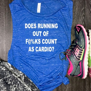 May include: Blue sleeveless shirt with the text "Does running out of f@%ks count as cardio?" printed in white. The shirt is paired with black and pink running shoes.