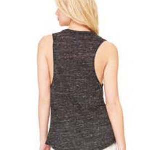May include: A black and gray sleeveless shirt with a relaxed fit. The shirt is made of a soft, comfortable fabric and has a slightly distressed look.