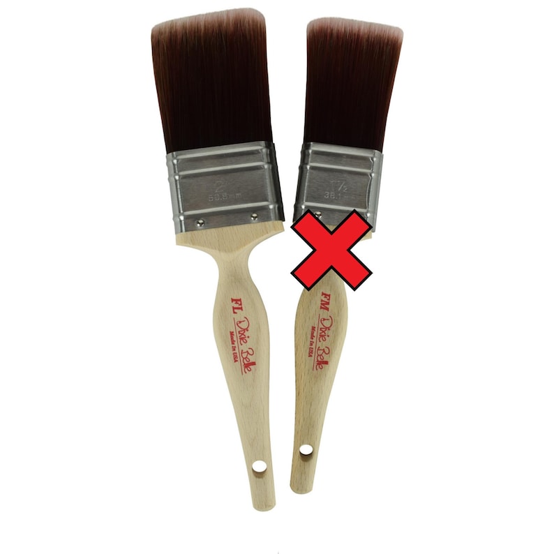 May include: Two paint brushes with wooden handles and silver ferrules. The brush on the left is labeled "FL Dixie Belle Made in USA" and the brush on the right is labeled "FM Dixie Belle Made in USA".