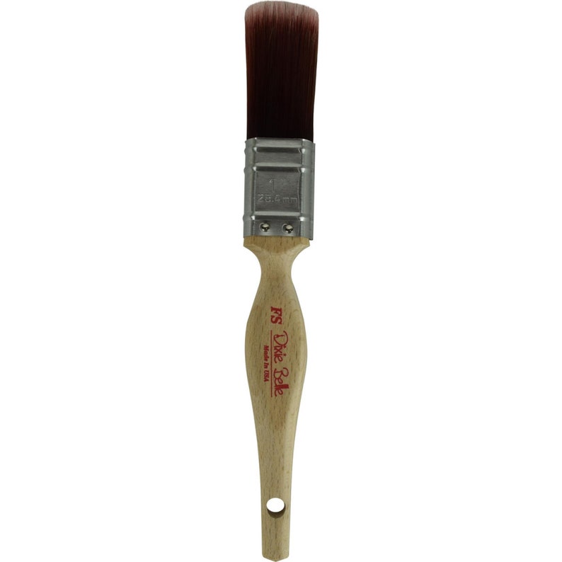 May include: A 1-inch angled sash brush with a wooden handle and a silver ferrule. The brush is labeled "Dixie Belle FS Made in USA".