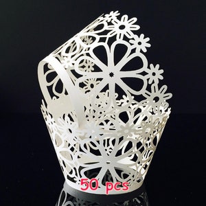 May include: White cupcake liners with a delicate floral lace design. 50 pieces.