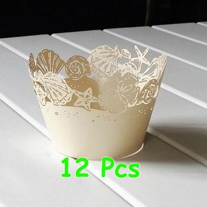12 st elfenbensfärgade schabloner snäckskal muffinshållare snäckskal sjöstjärna omslag sjöstjärna muffins omslagspapper havsfina bröllopsfest omslag halsband