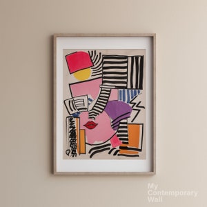 Puede incluir: Impresión de arte abstracto con un diseño geométrico colorido en rosa, morado, amarillo, rojo, negro, blanco y azul. El diseño recuerda a una cara con un labio rojo audaz.