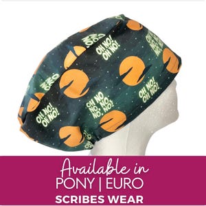 May include: A black and orange scrub hat with a repeating pattern of the text "Oh No!" and a stylised UFO. The hat is available in pony and euro sizes.