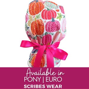 May include: A scrub cap featuring a white background with a colorful pumpkin pattern in shades of orange, pink, and green, accented by a bright hot pink satin ribbon tied in a bow at the back. The text below reads Available in PONY | EURO SCRIBES WEAR.