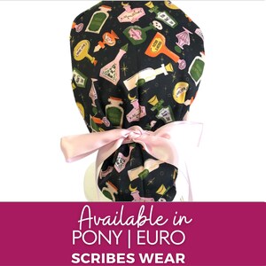 May include: A black scrub hat with a pink ribbon tie. The hat has a pattern of colorful bottles and stars. The text "Available in PONY | EURO SCRIBES WEAR" is at the bottom of the image.