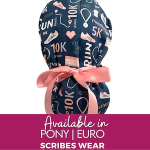 May include: A blue and pink patterned scrub hat with a pink ribbon tied around it. The hat has a variety of running-themed words and images, including "10K", "marathon", "sweat", and "you can do it".