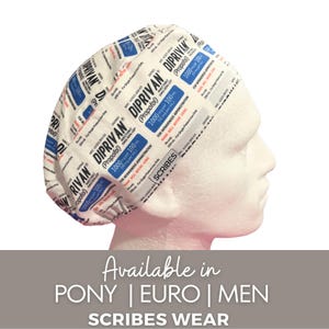 May include: A scrub cap featuring a repeating pattern of Diprivan medication labels in black, blue, and red text on a white background. The fabric displays details including the drug name, dosage of 1000 mg per 100 ml, and medical warnings. A small white tag with the text SCRIBES is visible on the side.