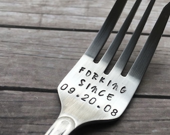 May include: A silver fork with the words "Forking Since 09.20.08" engraved on the handle.