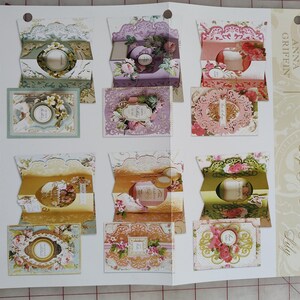 May include: A set of three ceramic mugs with a speckled, matte finish. The mugs are in shades of cream, light gray, and dark gray. Each mug has a simple, minimalist design and a rounded handle.