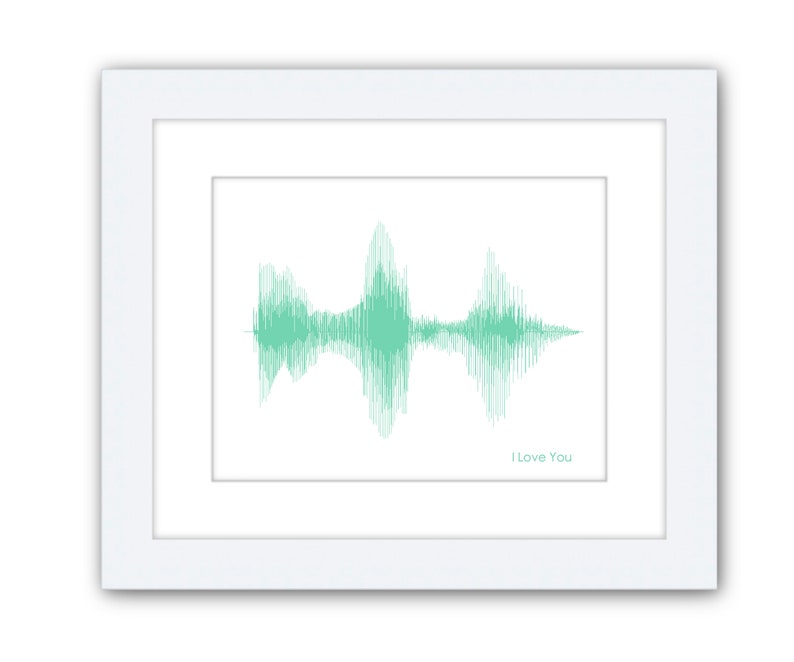 May include: A framed print of a green sound wave with the text "I Love You" below it.