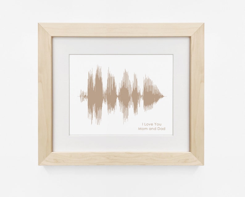 May include: A framed print of a sound wave in brown tones, with the text "I Love You Mom and Dad" below the wave.