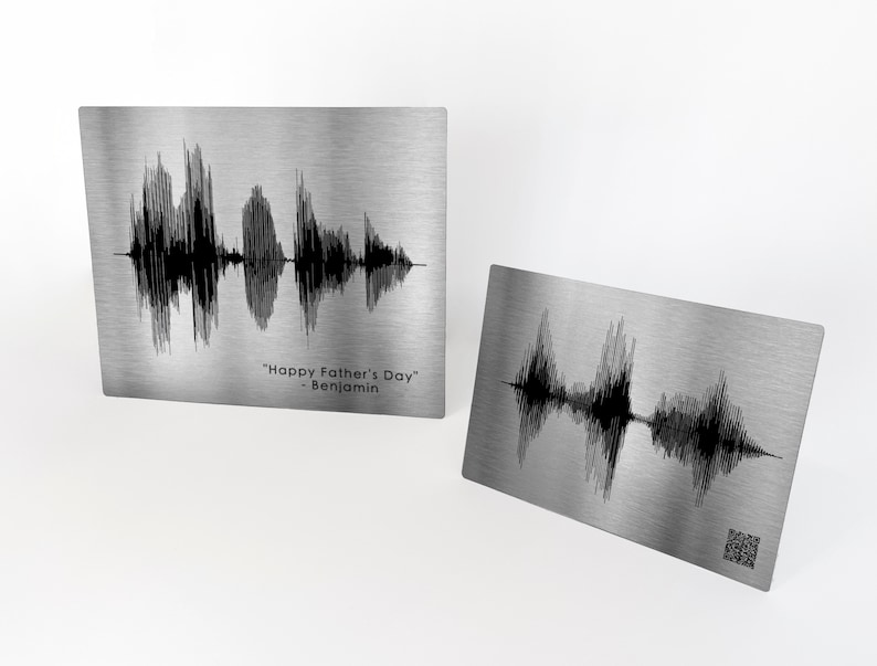 May include: Two silver metal plates with black sound wave designs. The top plate has the text "Happy Father's Day - Benjamin".