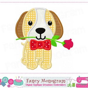 May include: An embroidered design of a cartoon dog holding a red rose. The dog has a white face, yellow body with white polka dots, brown ears, and a red bow tie. The text "Fancy Monogram" is at the bottom of the image.