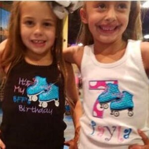 May include: Two girls wearing white and black tank tops with blue roller skate embroidery. The black tank top says "It's My BFF's Birthday" and the white tank top says "7" with pink polka dots and "Jayla".