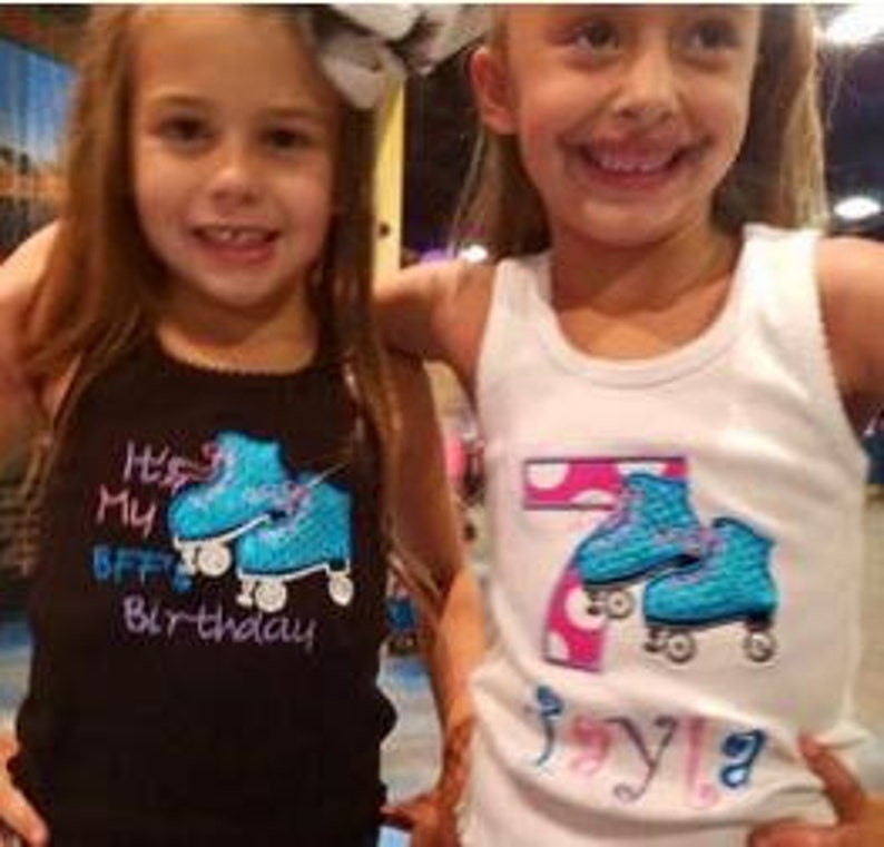 May include: Two girls wearing white and black tank tops with blue roller skate embroidery. The black tank top says "It's My BFF's Birthday" and the white tank top says "7" with pink polka dots and "Jayla".