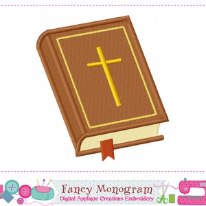 May include: A brown leather-bound book with a gold cross on the cover and a red bookmark. The book is closed and has a yellow border around the edges.
