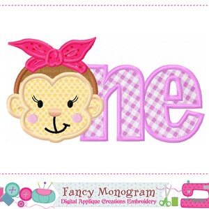 May include: Embroidered applique design featuring a pink and white checkered "one" with a cute monkey wearing a pink bow. The design is perfect for a first birthday party.