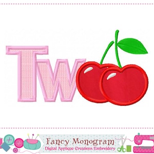 May include: Pink embroidered applique of the word "Two" with two red cherries.