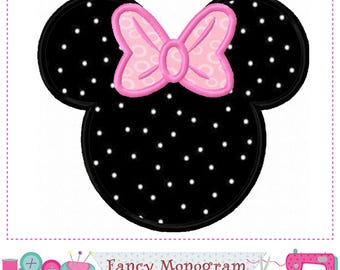 May include: A black mouse-shaped applique patch featuring a white polka dot pattern and a light pink bow with a textured circular design. The patch has a thick black stitched border and is presented as a digital embroidery file design.