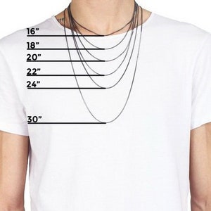 May include: A white t-shirt with a model wearing a variety of silver chains, with measurements in inches from 16 to 30 inches.