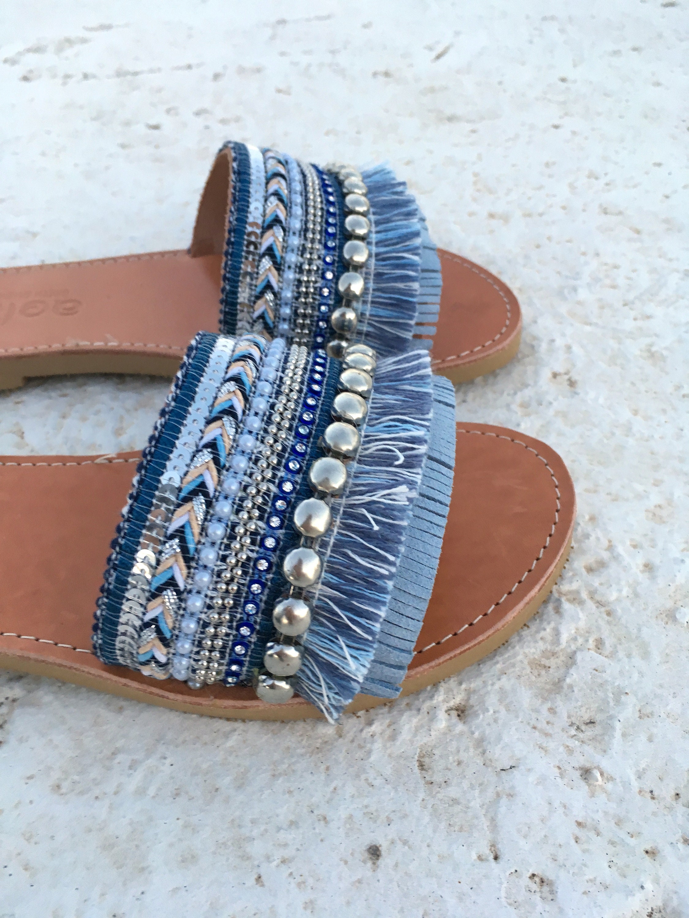 woman leather sandals with blue decorate
