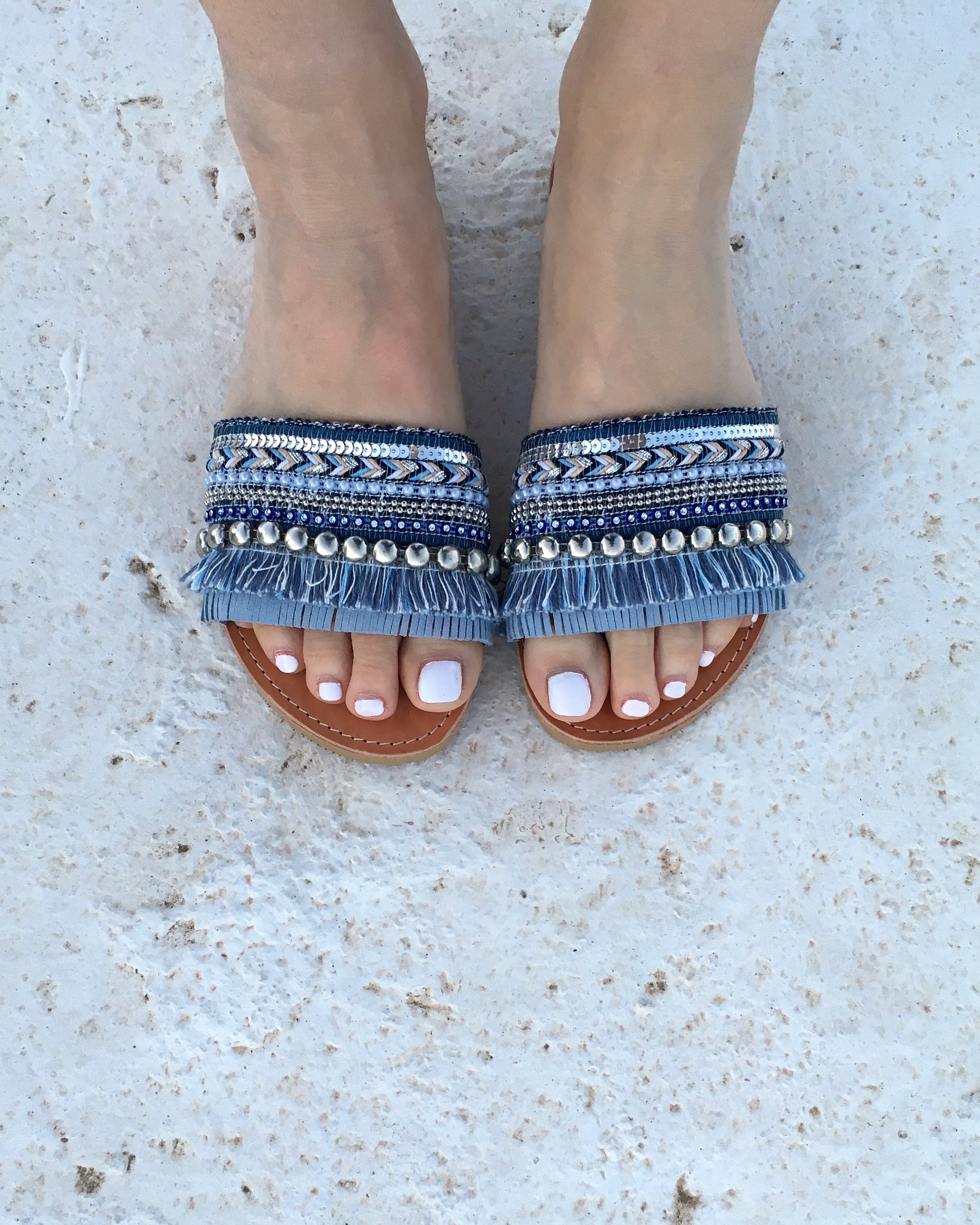 woman leather sandals with blue decorate