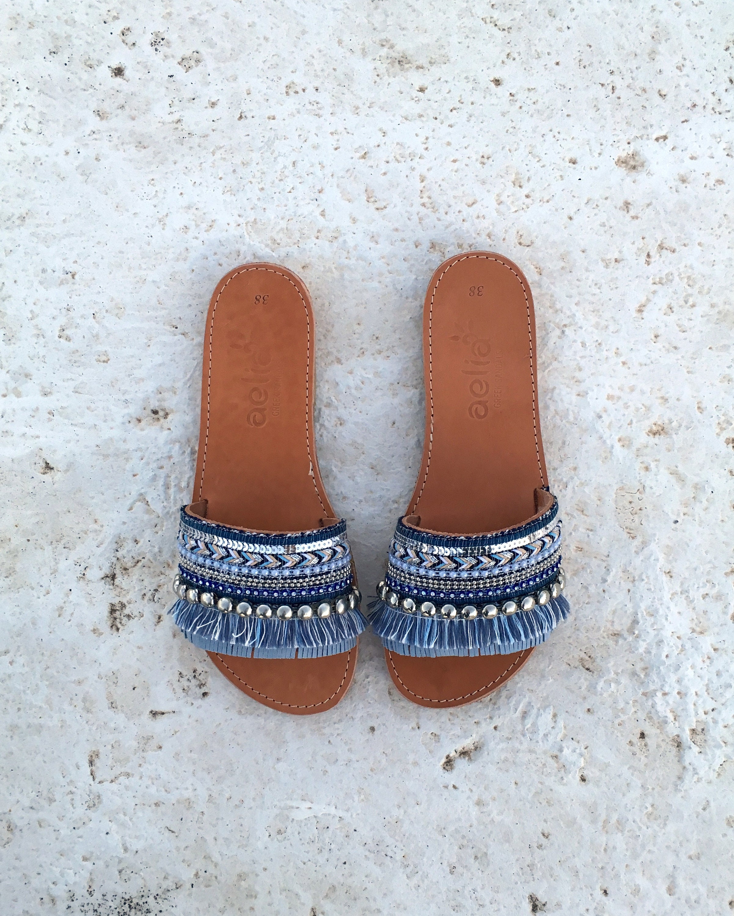 woman leather sandals with blue decorate