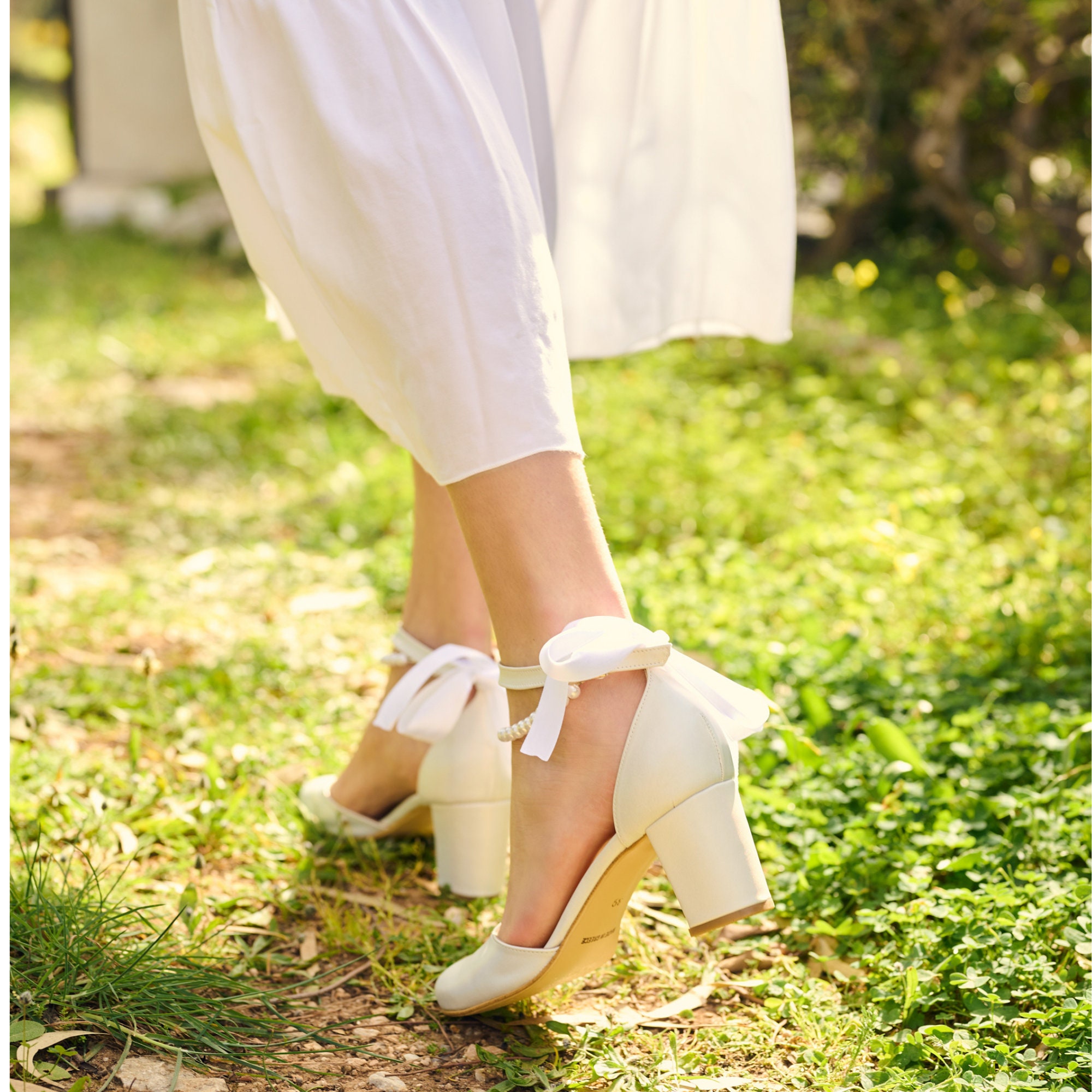 Buy White Embellished Pearl Strap Block Heels by Modanta Footwear Online at  Aza Fashions.