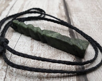 New Zealand pounamu Greenstone jade swirl pendant.