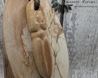 Maple wood carved goddess deity pendant.