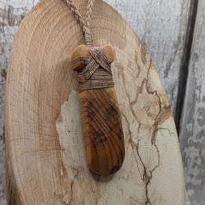 yew wood Hei Toki adze styled simple pendant - Handcrafted British carved jewellery, Māori inspired nature talisman, eco friendly.
