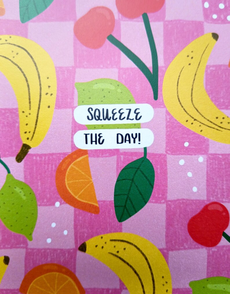 May include: Pink and white checkered background with a variety of fruit illustrations, including bananas, lemons, oranges, and cherries. The text "SQUEEZE THE DAY!" is written in black on a white background.